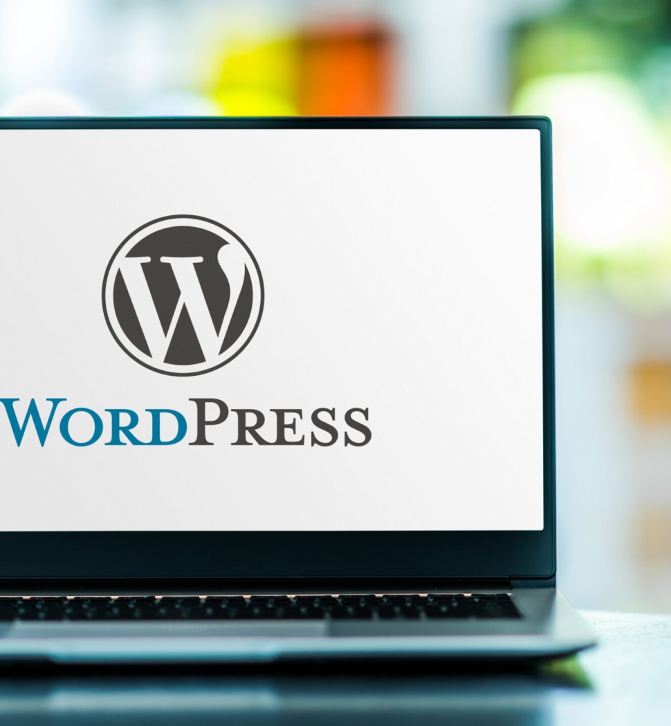 POZNAN, POL - FEB 6, 2021: Laptop computer displaying logo of WordPress, a free and open-source content management system (CMS) written in PHP and paired with a MySQL or MariaDB database